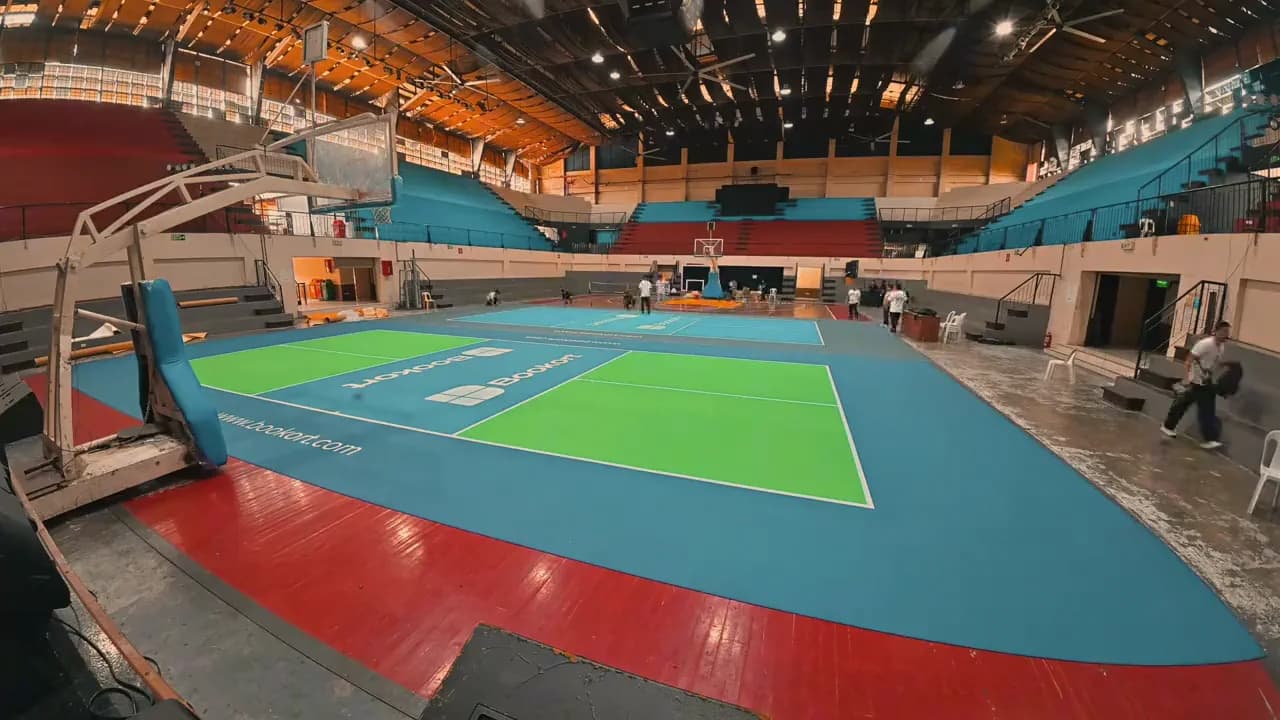 A Bookort pickleball court laid out on a gymnasium floor