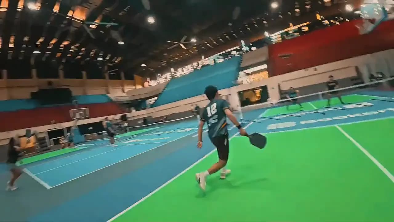 A player running for the ball on a Bookort pickleball court